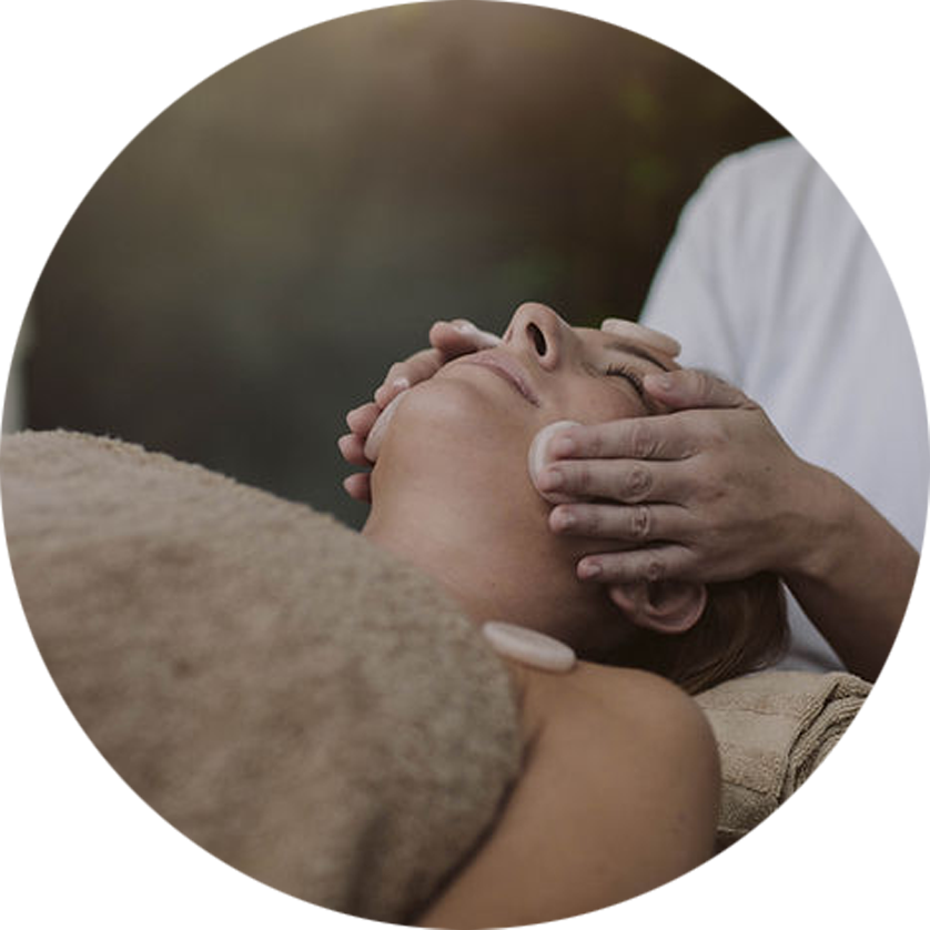 An image of a woman receiving a facial massage.